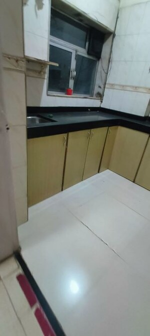 Kitchen in 2 BHK Apartment at Godrej Edenwoods, Manpada – for Rent