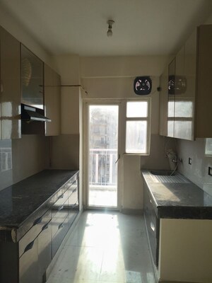 Kitchen in 2 BHK Apartment at Paramount Emotions, Sector 1 Greater Noida – for Rent