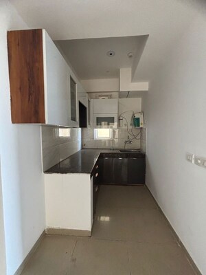 Kitchen in 2.5 BHK Apartment at Shri Radha Sky Gardens, Sector 16b Greater Noida – for Sale