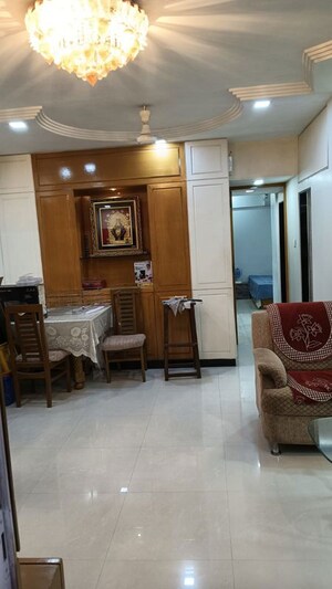 Living Room in 2 BHK Apartment at Abrol Krishna Utsav, Malad West – for Rent