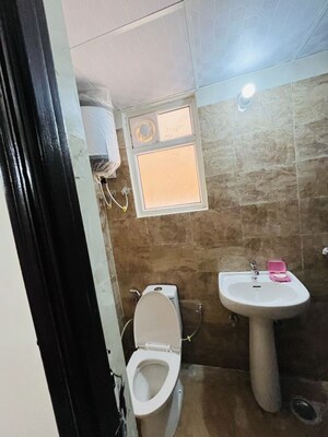 Bathroom in 1 BHK Apartment at Kingson ARV Arcade, Raj Nagar Extension – for Rent