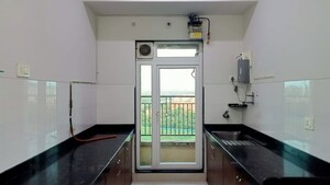 Kitchen in 2 BHK Apartment at Rustomjee Azziano Wing I, Thane West – for Rent