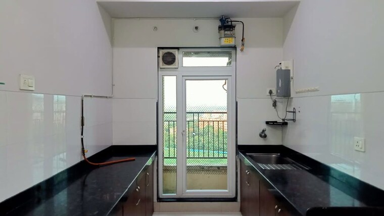 Kitchen, rustomjee-azziano-wing-i 2 Bedroom 820 Sq.Ft. Apartment In Thane West Thane 10414165