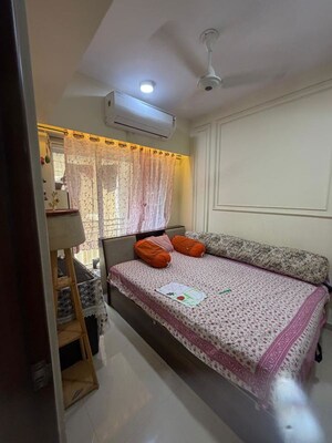 Bedroom in 2 BHK Apartment at Nisha Residency, Goregaon West – for Sale