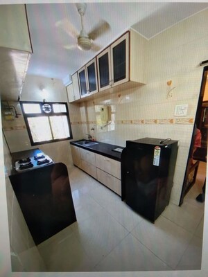 Kitchen in 3 BHK Apartment at Neminath Imperia, Andheri West – for Rent