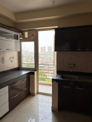Kitchen in 2 BHK Apartment at Mahindra Aura, Sector 110a – for Rent
