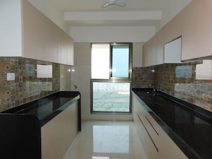 Kitchen in 3 BHK Apartment at Raj Infinia, Malad West – for Rent