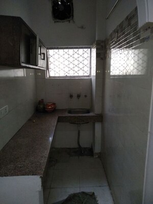 Kitchen in 1.5 BHK Builder Floor at Amar Colony – for Rent