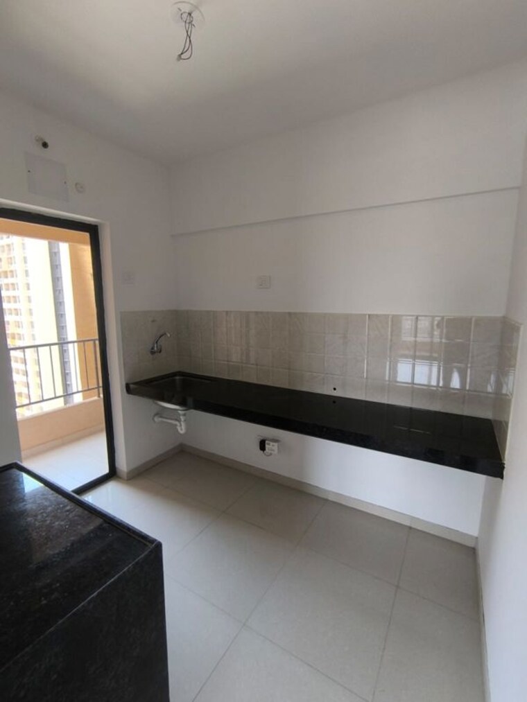 Kitchen, shapoorji-pallonji-joyville-hadapsar-annexe 2 Bedroom 726 Sq.Ft. Apartment In Hadapsar Pune 10358841