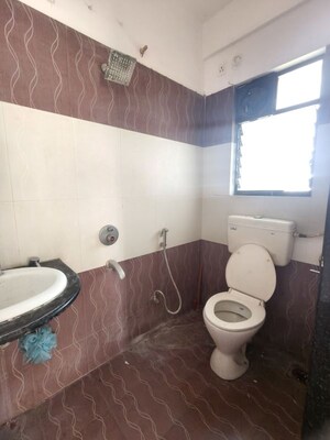 Bathroom in 2 BHK Apartment at Kolte Patil Margosa Heights, Mohammadwadi – for Rent