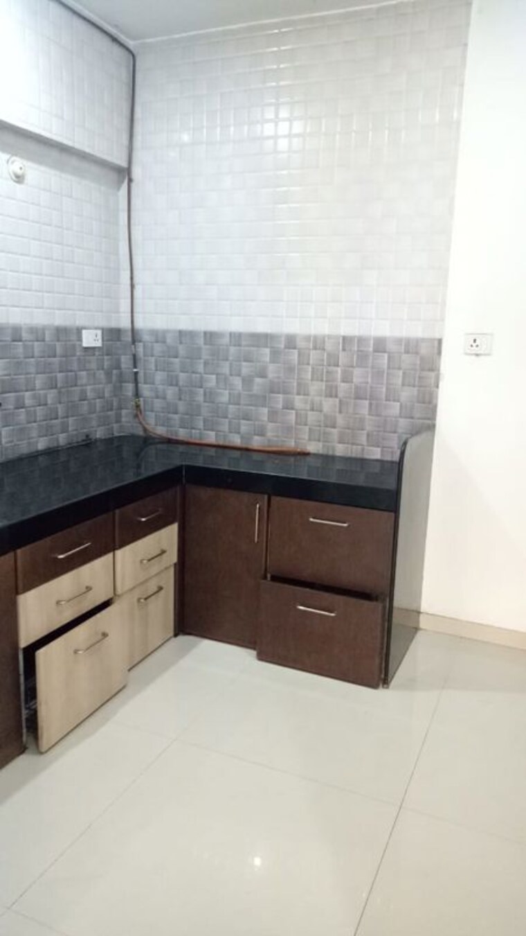Kitchen, essen-aishwaryam-comfort-phase-i 2 Bedroom 890 Sq.Ft. Apartment In Akurdi Pune 10415572