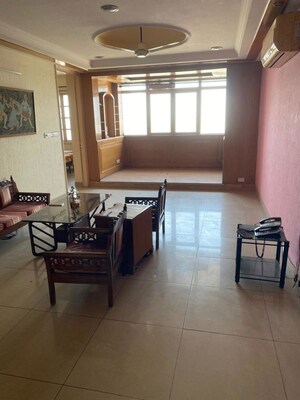 Living Room in 3 BHK Apartment at Eros Woodbury Tower, Charmwood Village – for Sale