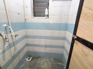 Bathroom in 1 BHK Apartment at Shalmali Cooperative Housing Society, Vasant Vihar – for Rent
