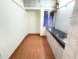 Kitchen in 1 BHK Apartment at Shalmali Cooperative Housing Society, Vasant Vihar – for Rent