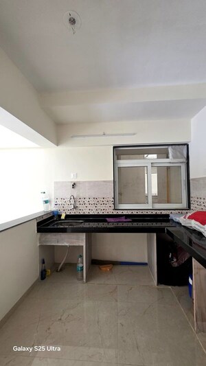 Kitchen in 2 BHK Apartment at Mahavir Square, Manpada – for Sale