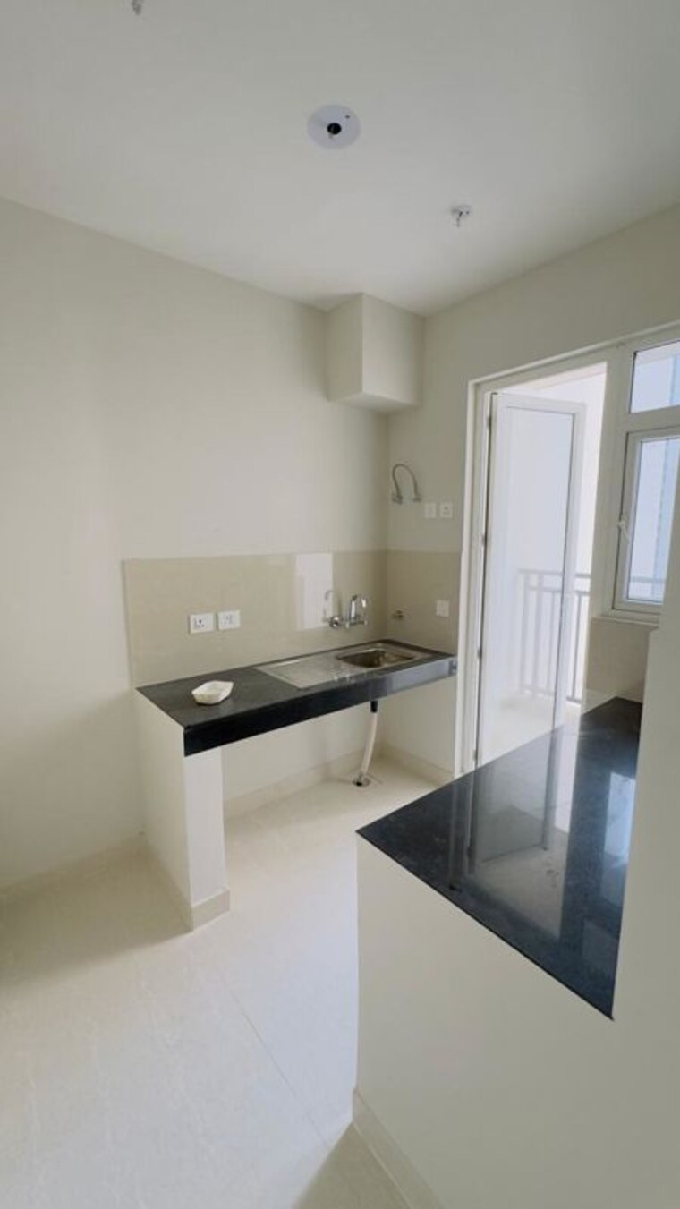 Kitchen, eldeco-live-by-the-greens 2 Bedroom 1137 Sq.Ft. Apartment In Sector 150 Noida 10414092