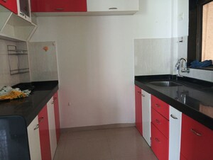 Kitchen in 1.5 BHK Apartment at Shree Satya Shankar Residency, Manpada – for Sale