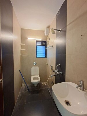 Bathroom in 2 BHK Apartment at Avkar Happy Homes CHS Ltd, Borivali West – for Rent