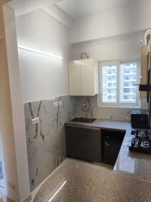 Kitchen in Studio Apartment at Purvanchal Royal City, Chi V Greater Noida – for Sale
