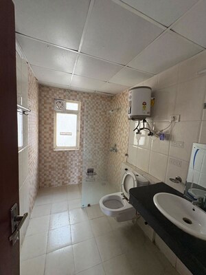 Bathroom in 3 BHK Apartment at Nimbus The Golden Palm, Sector 168 – for Rent