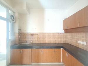 Kitchen in 2 BHK Apartment at Mahagun My Woods, Sector 16c Greater Noida – for Rent