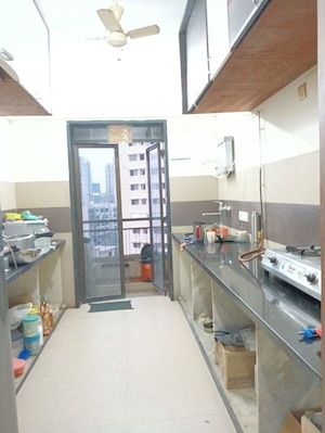 Kitchen in 2 BHK Apartment at Omkar Alta Monte, Malad East – for Rent