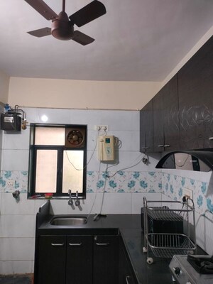 Kitchen in 2 BHK Apartment at Brindaban Mathura CHS, Vrindavan Society – for Sale
