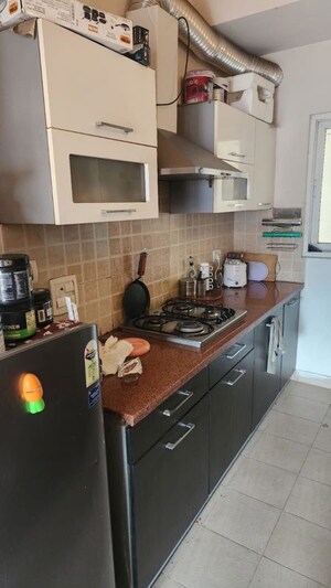 Kitchen in 2.5 BHK Apartment at Mahagun Moderne, Sector 78 – for Sale
