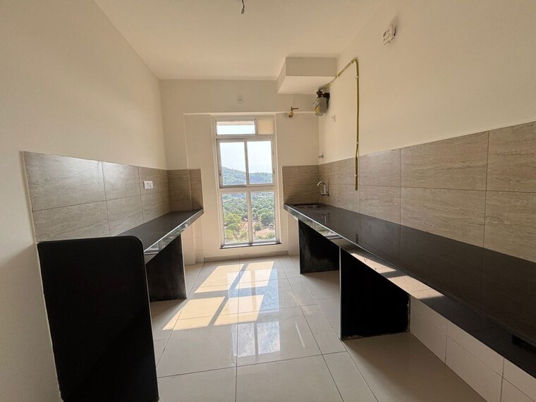 Kitchen, godrej-emerald 2 Bedroom 808 Sq.Ft. Apartment In Ghodbunder Road Thane 10419026