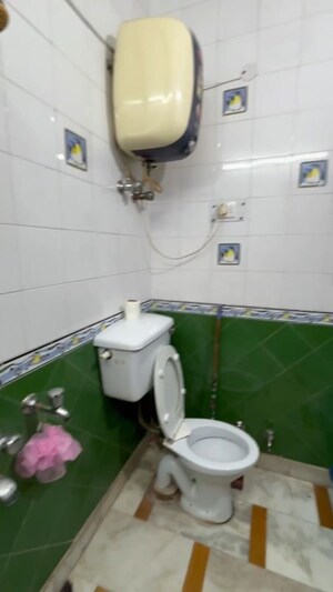Bathroom in 3 BHK Builder Floor at Mansarover Garden – for Sale