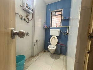 Bathroom in 2 BHK Apartment at Unnati Woods CHS, Kasarvadavali – for Sale