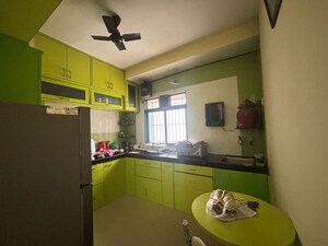 Kitchen in 2 BHK Apartment at Unnati Woods CHS, Kasarvadavali – for Sale