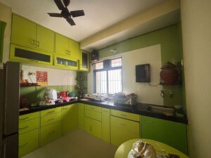 Kitchen in 2 BHK Apartment at Unnati Woods CHS, Kasarvadavali – for Sale