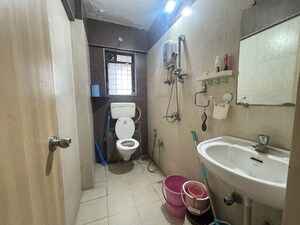 Bathroom in 2 BHK Apartment at Unnati Woods CHS, Kasarvadavali – for Sale