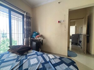 Bedroom in 2 BHK Apartment at Unnati Woods CHS, Kasarvadavali – for Sale