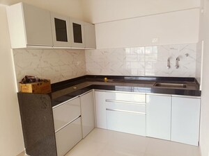 Kitchen in 2 BHK Apartment at Mantra Essence, Undri – for Rent