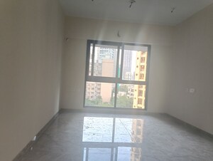 Room in 2 BHK Apartment at Ajmera Boulevard, Malad West – for Rent