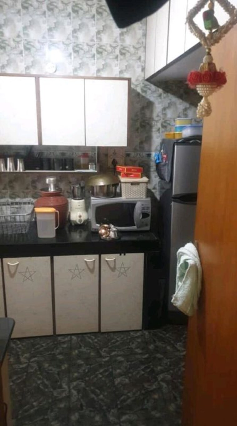 Kitchen, lokhandwala-whispering-palms 2 Bedroom 850 Sq.Ft. Apartment In Kandivali East Mumbai 10421722