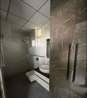 Bathroom in 3 BHK Apartment at Maya Green Lotus Utsav, International Airport Road – for Rent