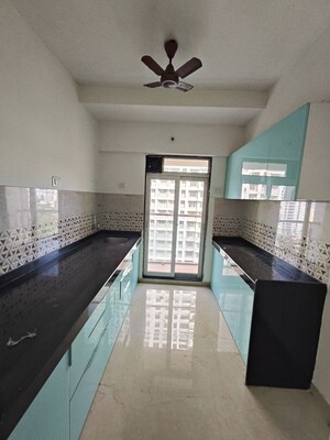 Kitchen in 2 BHK Apartment at Mahavir Square, Manpada – for Sale