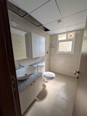 Bathroom in 3 BHK Apartment at Bhartiya City Nikoo Homes 4, Thanisandra Main Road – for Rent