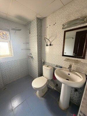 Bathroom in 2 BHK Apartment at Aims Golf City, Sector 75 – for Rent