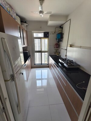Kitchen in 3 BHK Apartment at Godrej Emerald, Ghodbunder Road – for Rent
