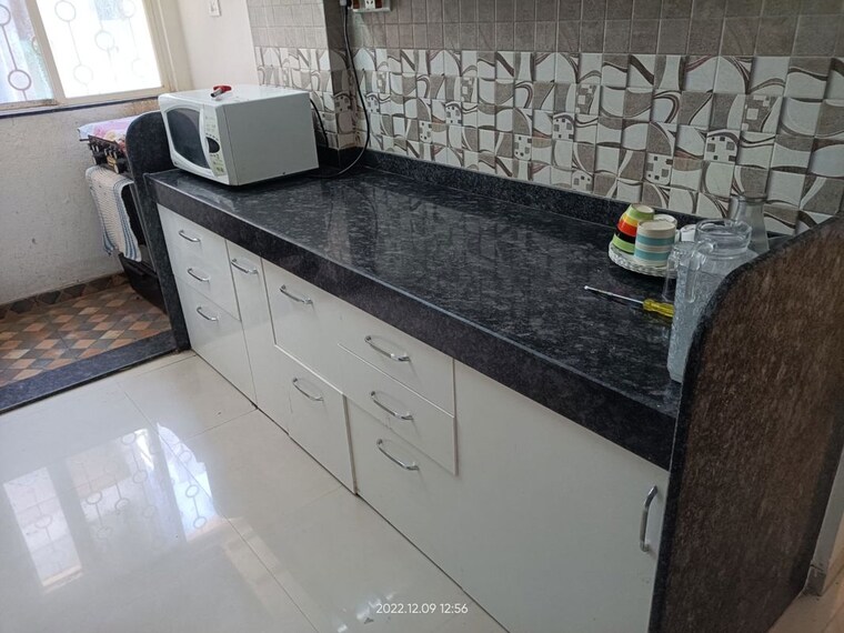 Kitchen, raheja-gardens 1 Bedroom 560 Sq.Ft. Apartment In Wanwadi Pune 10425205