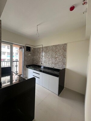 Kitchen in 2 BHK Apartment at Raunak Residency Thane, Pokhran Road No One – for Rent
