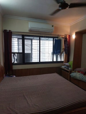 Bedroom in 2 BHK Apartment at Goyal Lakshchandi Heights, Goregaon East – for Rent