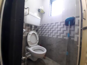 Bathroom in 1 BHK Apartment at Unnat Nagar CHS, Goregaon West – for Rent