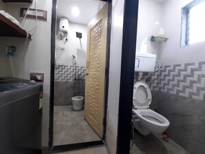 Bathroom in 1 BHK Apartment at Unnat Nagar CHS, Goregaon West – for Rent
