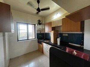 Kitchen in 2 BHK Apartment at Metropolis Rivera, Kasarvadavali – for Rent