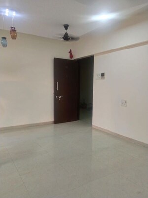Living Room in 2 BHK Apartment at Galaxy Carina, Kharghar – for Rent
